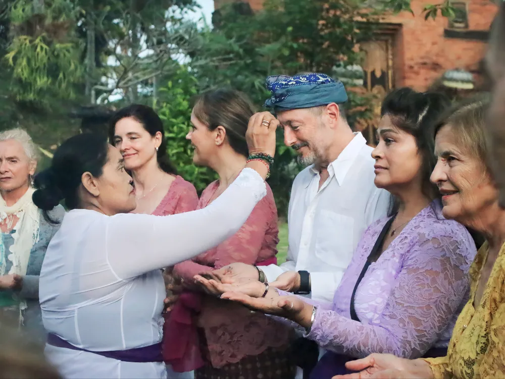 Travellers receiving a Balinese blessing