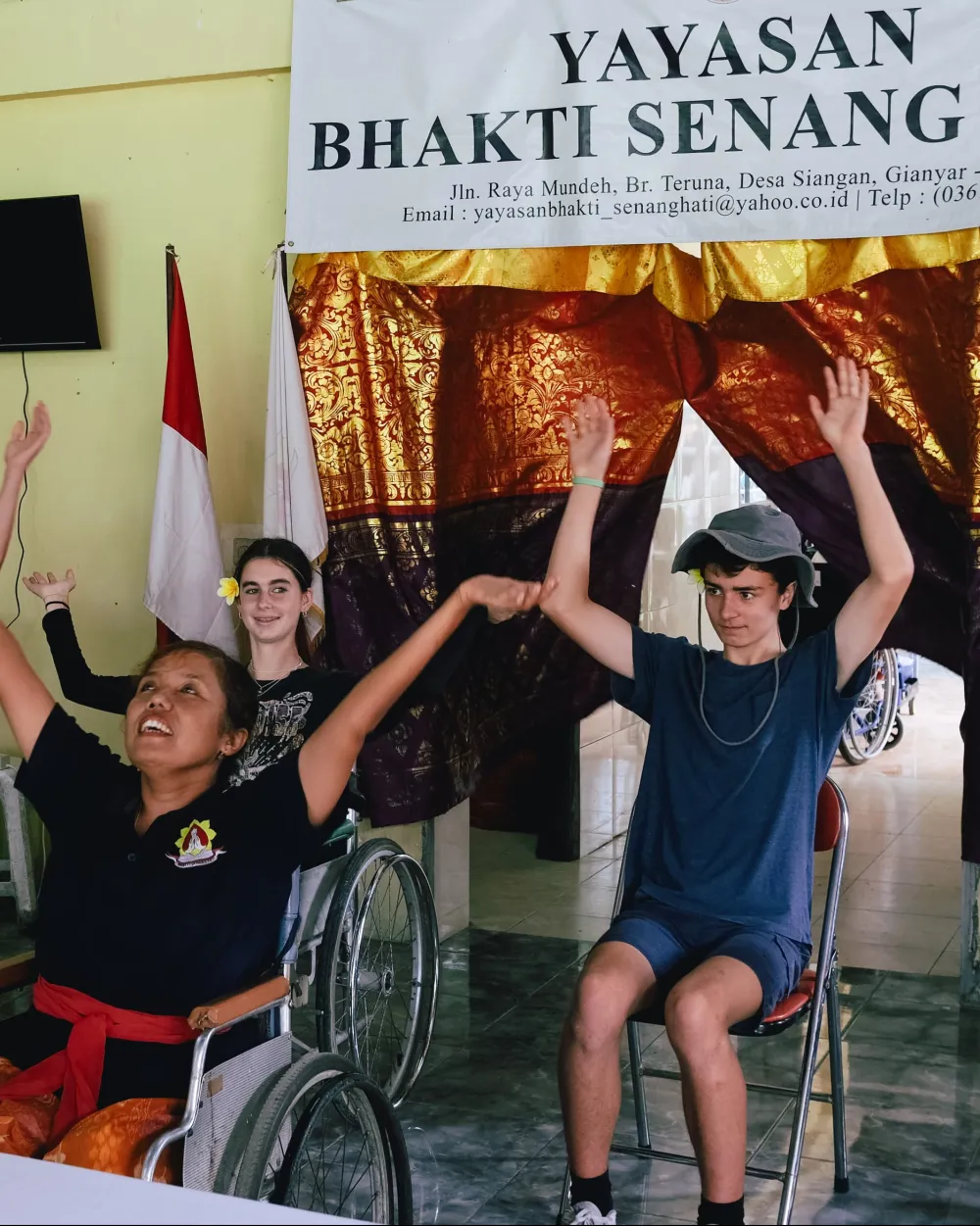 Travelers joining a movement session with members of Yayasan Bhakti Senang Hati, a disability community in Bali
